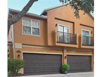 Contemporary townhouse with individual garages and balconies at 2330 Little Gem Loop, Sanford, FL 32773