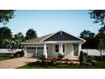 Charming one-story home with a welcoming porch, attached two-car garage, and beautifully landscaped front yard at 322 Ridgemark Ave, Groveland, FL 34736