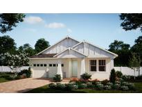 Charming single-Gathering home with a two-car garage, pristine landscaping, and a welcoming front porch at 347 Ridgemark Ave, Groveland, FL 34736
