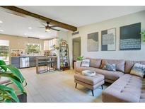 Bright living room featuring a comfortable sectional sofa and stylish decor at 633 E Church Ave, Longwood, FL 32750