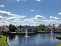 Beautiful waterfront community featuring multiple fountains, mature landscaping and ample parking at 2524 Woodgate Blvd # 201, Orlando, FL 32822