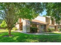 Brick home with a lush lawn and mature trees offers a serene and inviting setting at 470 Oak Haven Dr # 470, Altamonte Springs, FL 32701