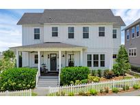 Charming two-story home with a welcoming front porch and beautifully landscaped yard at 1071 Kershaw Dr, Winter Garden, FL 34787