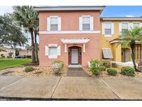 Charming two-story home featuring a well-maintained lawn and welcoming entrance at 1084 Park Ridge Cir, Kissimmee, FL 34746