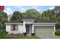 Charming one-story home featuring a two-car garage, neutral paint, and lush landscaping at 2026 Firethorn Loop, Haines City, FL 33844