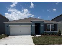 Charming single-story home with a well-manicured lawn and a two-car garage at 3320 Wynwood Forest Dr, Ocoee, FL 34761