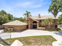 Stunning two-story home featuring a grand entrance and a matching detached two-car garage at 4674 Hall Rd, Orlando, FL 32817