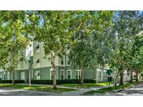Charming multi-story townhome featuring well-maintained landscaping and manicured greenery at 501 Water St # 501, Celebration, FL 34747