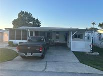 Charming single-story home with covered parking and decorative landscaping at 816 Polo Park East Blvd, Davenport, FL 33897