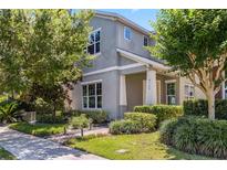 Charming two-story home with well-manicured landscaping and a welcoming front porch at 8160 Iron Mountain Trl, Windermere, FL 34786