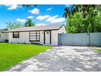 Charming single-story home with a well-manicured lawn and inviting curb appeal, perfect for a starter home at 228 Ring Rd, Orlando, FL 32811