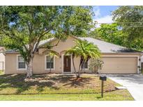 Charming single-story home with a well-maintained yard and mature trees at 778 Del Prado Dr, Kissimmee, FL 34758