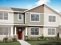 Inviting home exterior with varied textures, including lap siding, shingles, and stone accents, and a well-manicured lawn at 3025 Douglas Fir Dr, Apopka, FL 32703