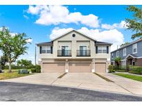 Well-maintained townhome featuring a private balcony and attached one-car garage at 6404 S Goldenrod Rd # A, Orlando, FL 32822