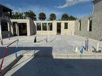 Foundation slab with block walls, under construction, shows plumbing infrastructure and window openings at 1153 Basalt Ln, Sanford, FL 32771