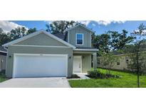 Charming two-story home featuring a well-maintained lawn and attached two-car garage at 164 14Th Ave, Longwood, FL 32750