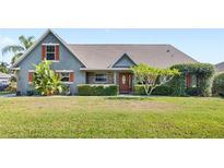 Charming single-story home with landscaped front yard and inviting curb appeal at 1880 Lorraine Way, St Cloud, FL 34769