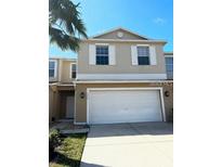 Charming townhouse with two-car garage and neutral color palette at 3530 Rodrick Cir, Orlando, FL 32824