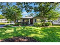 Charming home with mature landscaping and a welcoming front porch at 927 Boardman St, Orlando, FL 32804