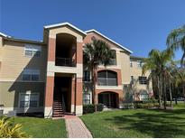Inviting exterior showcasing well-maintained grounds and colorful architecture, enhancing curb appeal at 1950 Summer Club Dr # 202, Oviedo, FL 32765