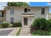Inviting condo exterior featuring a well-maintained facade and beautiful landscaping at 200 Maitland Ave # 19, Altamonte Springs, FL 32701