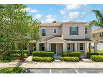 Charming townhome featuring well-manicured landscaping and a welcoming front porch at 3112 Seaview Castle Dr, Kissimmee, FL 34746