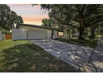 Charming one-story home with a two car garage, mature landscaping, and inviting curb appeal at 641 Peachwood Dr, Altamonte Springs, FL 32714