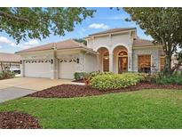 Charming single-Gathering home with a three-car garage, well-manicured lawn, and beautiful landscaping at 1266 Saint Albans Loop, Lake Mary, FL 32746