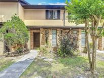 Charming two-story home with a well-manicured front yard and brick facade at 1806 Foxhall Cir # 1806, Kissimmee, FL 34741