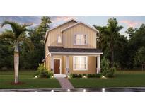 Charming two-story home featuring a cozy front porch and well-maintained landscaping at 2441 Spring Tune Aly, Kissimmee, FL 34744