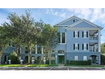 Attractive two-story condo building with well maintained landscaping and on-site parking at 3561 Conroy Rd # 216, Orlando, FL 32839