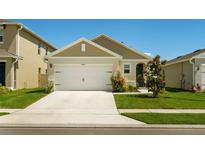 Charming single-story home featuring a two-car garage, neutral paint scheme, and well-maintained front lawn at 3624 Sungrove Cir, Sanford, FL 32771