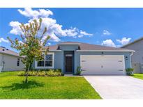 Charming one-story home featuring a two-car garage, well-maintained lawn, and inviting curb appeal at 3723 Alder Bark Ln, Sanford, FL 32773