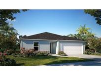 Charming single-story home features a two-car garage, manicured lawn, and lush landscaping at 103 Orchid Ct, Poinciana, FL 34759