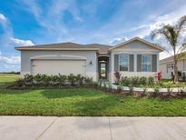 Charming single-story home featuring manicured landscaping and neutral color palette at 3318 Arch Ave, Ormond Beach, FL 32174