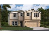 Charming two-story home featuring a two-car garage, manicured lawn, and stylish tan and beige siding at 459 Puma Loop, Groveland, FL 34736