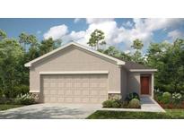 Charming single-story home with a two-car garage and a beautifully landscaped front yard at 5117 Forget Me Not Ave, Lake Hamilton, FL 33851
