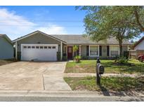 Charming single-story home featuring a two-car garage and a well-maintained front yard at 978 N Jerico Dr, Casselberry, FL 32707