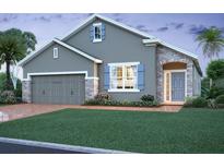 Charming single-Gathering home with a well-manicured lawn and stone accents, creating an inviting curb appeal at 2631 Great Heron Ave, St Cloud, FL 34773