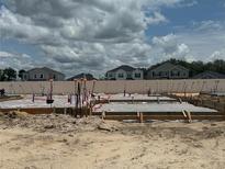 New home construction showing the foundation of the property with modern piping in a bright, sunny neighborhood at 809 River Stone Trl, Sanford, FL 32771