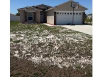 Charming single-Gathering home with a two-car garage and a basketball hoop at 112 Tulip Ln, Kissimmee, FL 34759