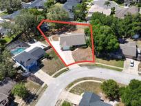 An aerial view of a single-Gathering home with a large yard and mature trees in a residential neighborhood at 1742 Willa Cir, Winter Park, FL 32792