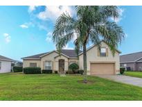 Charming home with beautiful green lawn and inviting curb appeal in a sunny location at 244 Ballyshannon Dr, Davenport, FL 33897