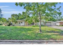 Charming single-story home with a well-maintained lawn and inviting curb appeal at 2524 Sweetwater Trl, Winter Park, FL 32789