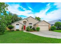 Charming single Gathering home with a well-manicured lawn and a bright red front door at 300 Churchill Dr, Longwood, FL 32779