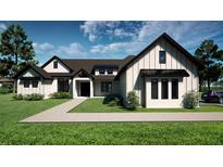 Stunning home featuring a modern design with a lush green lawn and beautiful landscaping at 9940 Black Bear Ln, Winter Garden, FL 34787