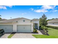 Charming single-Gathering home featuring a well-maintained lawn, two-car garage, and inviting front entrance at 2108 Antilles Club Dr, Kissimmee, FL 34747