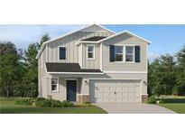 Charming two-story home with a well-maintained lawn and a two-car garage at 4070 Old Mill Rd, Haines City, FL 33844