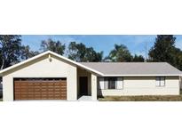 Charming single-story home with a well-maintained yard and a two-car garage, offering comfortable living at 622 N Goodrich Dr, Deltona, FL 32725