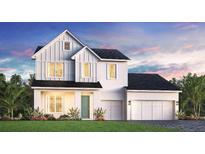 Charming two-story home featuring a clean white facade, a two-car garage, and lush landscaping at 1012 Gloryland Ct, Sanford, FL 32771